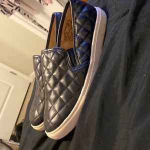 black quilted slip ons